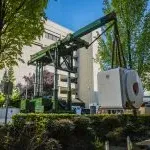 Tri-lifter with boom attachment installing MRI at Seattle hospital